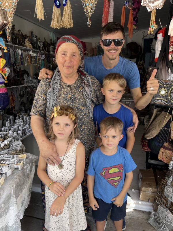 Fun times in Turkiye as a family - This was a handicraft seller in Troia