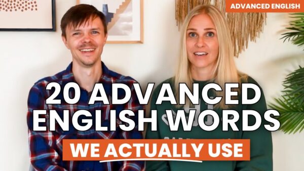 Two smiling people, one in plaid, one in green, against a decorated wall. Text: "20 Advanced English Words We Actually Use."